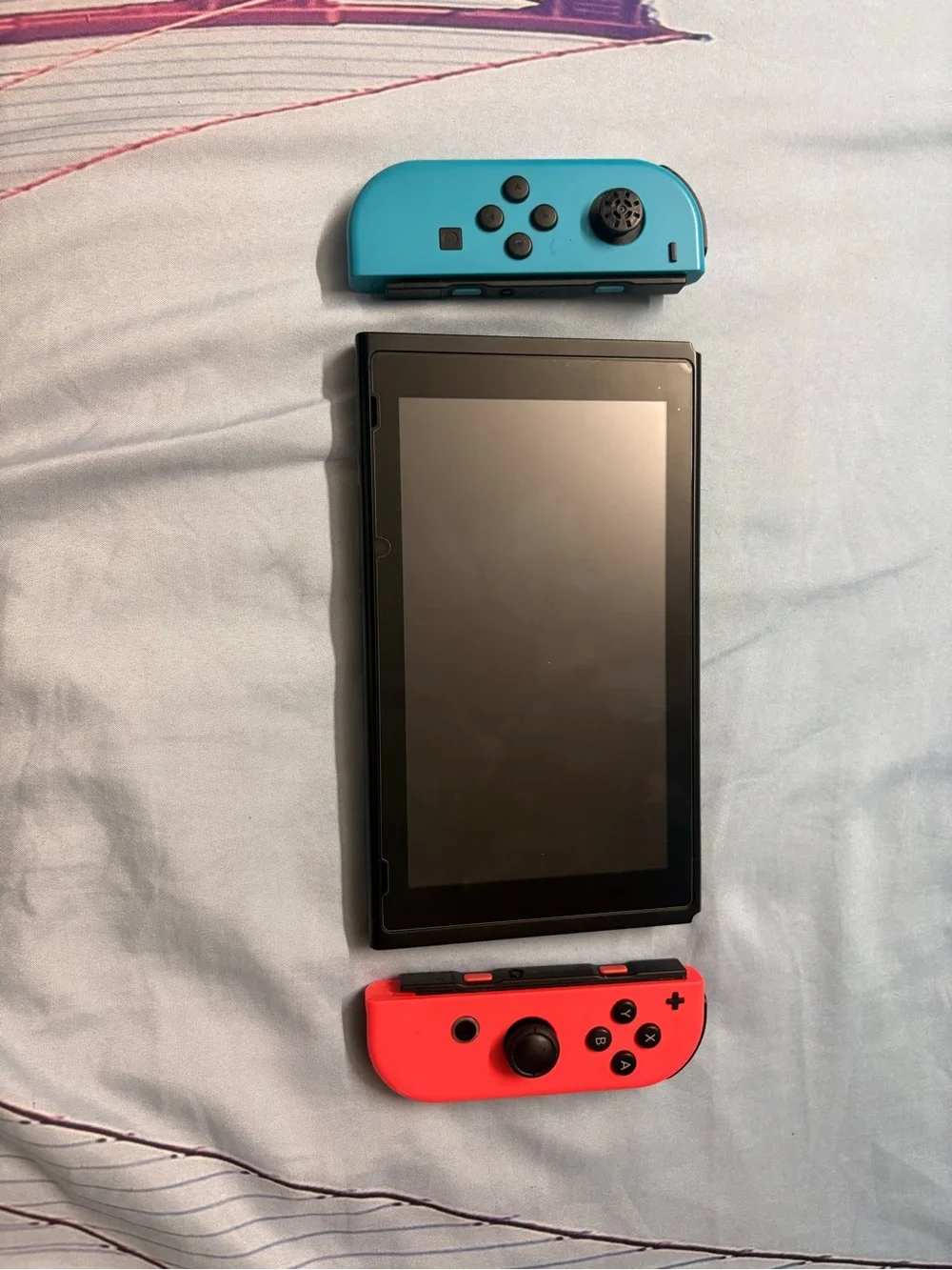 Nintendo Switch with Neon Red Right Joy‑Con and Neon Blue Left Joy‑Con